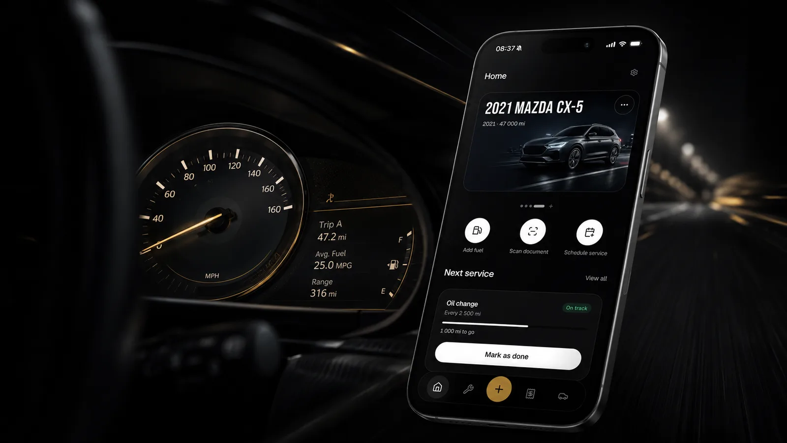 Maintory open on a phone beside a glowing car dashboard on a night drive
